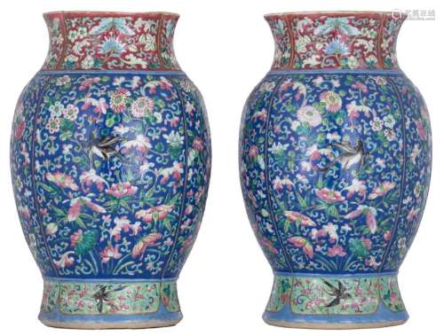 A pair of Chinese blue ground famille rose floral ...;