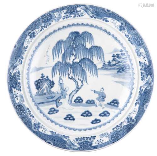A large Chinese deep charger, blue and white decor...;