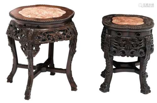 Two Chinese carved wooden stools with a marble top...;