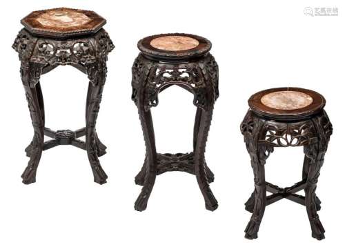 Three Chinese sculpted hardwood stools with a marb...;