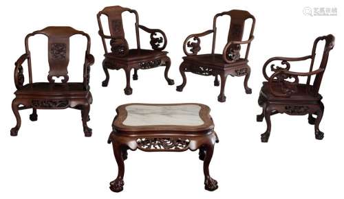 A set of four Chinese hardwood armchairs, sculpted...;