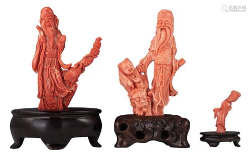 A lot of three finely carved pieces of red coral, ...;