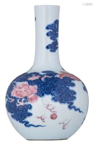 A Chinese cobalt blue and copper red bottle vase, ...;