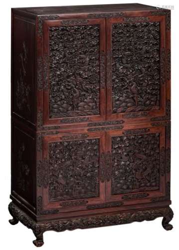 An Oriental four door cabinet in exotic hardwood, ...;