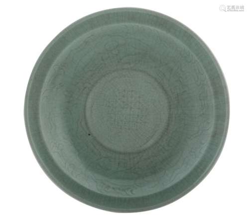 A large Chinese celadon stoneware plate with small...;