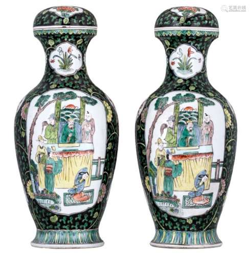 A pair of famille verte vases and cover, on a fami...;