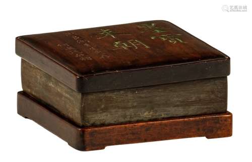 A Chinese ink stone in a wooden box and cover, the...;