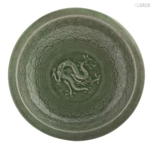 A Chinese celadon stoneware plate, decorated with ...;