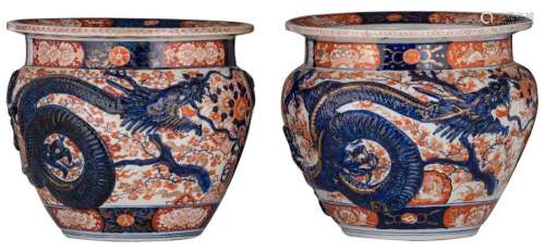 A pair of Japanese Arita Imari fish bowls, relief ...;