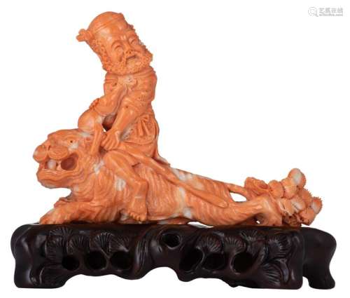 A finely carved piece of red coral, depicting the ...;