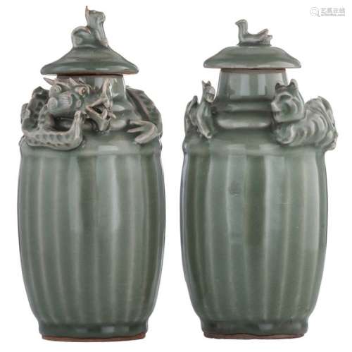 A pair of Chinese celadon stoneware urns with an o...;