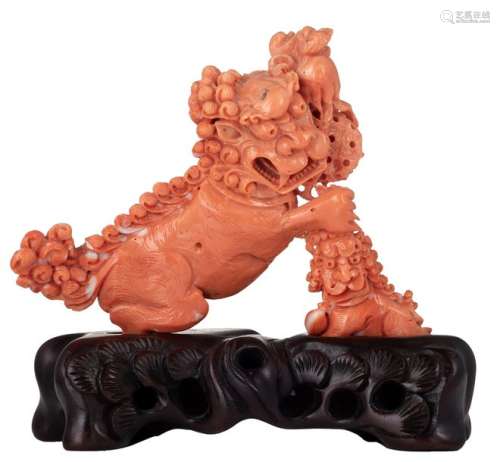 A finely carved piece of red coral, depicting a Fu...;