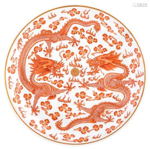 A Chinese iron red plate, decorated with five claw...;