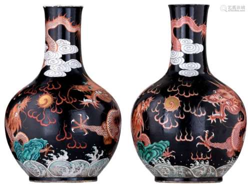 Two Chinese black ground polychrome bottle vases, ...;