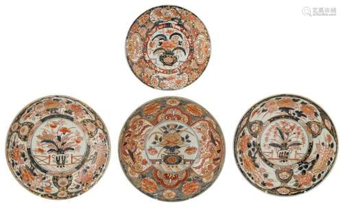 Four Japanese Arita Imari plates, central decorate...;