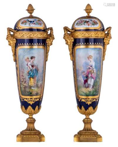A pair of covered vases with gilt bronze mounts, d…