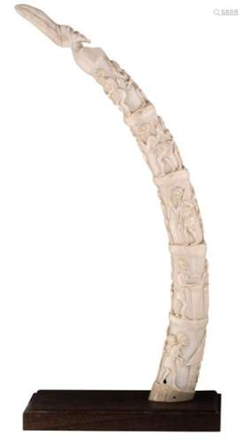 An African ivory tusk, all over sculpted with Afri…