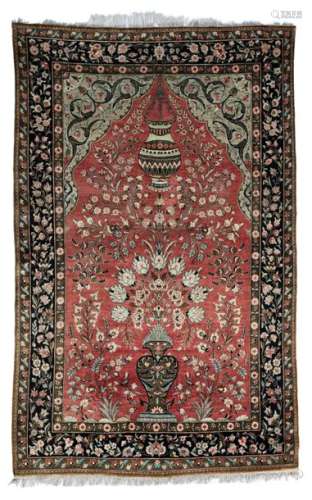 An Oriental prayer rug, decorated with a flower ba…