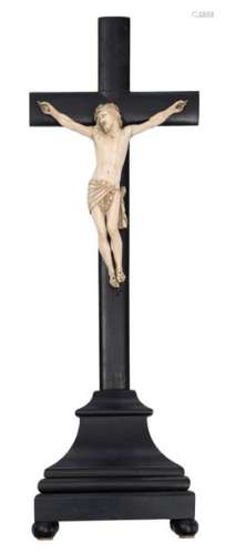 A 19thC ivory Corpus Christi on a wooden ebonised …