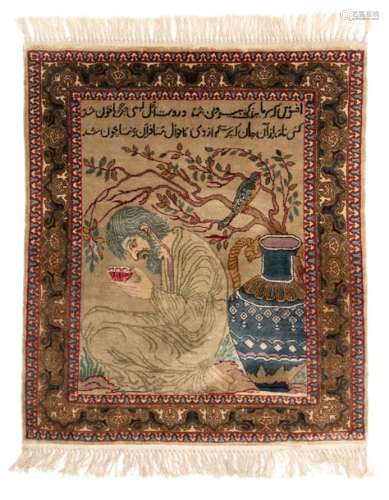 An Oriental silk carpet, decorated with a kneeling…