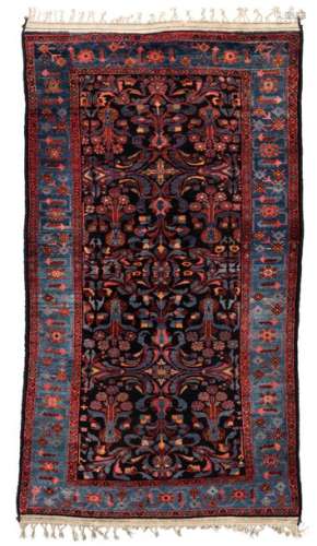 An Oriental woollen rug, 196 x 336 cm; added a dit…