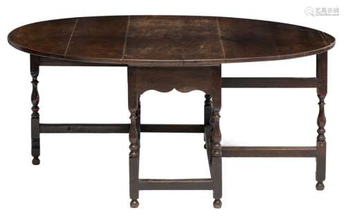 An oak gateleg table, H 71 W 159 / 51 x D 137 cm