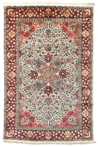 An Oriental silk carpet, 179 x 275 cm