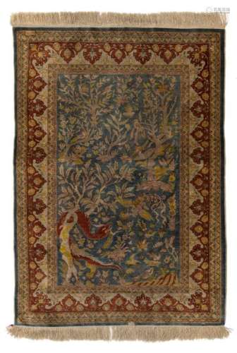 A fine Oriental silk rug, the field decorated with…