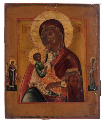 An East European icon of a Madonna with child flan…