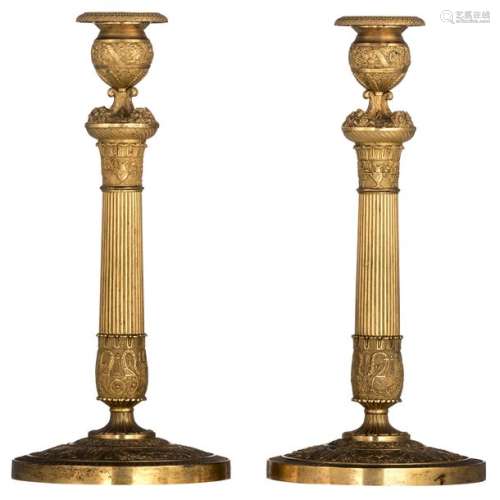 A fine pair of gilt bronze neoclassical candlestic…