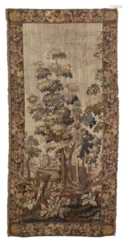 A 19thC tapestry depicting a landscape and floral …