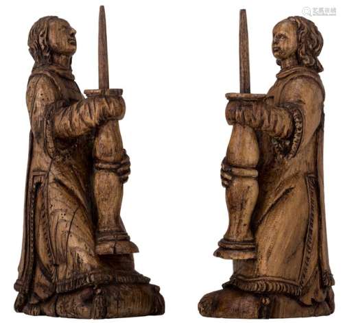 A pair of sculpted elm altar candlesticks, possibl…