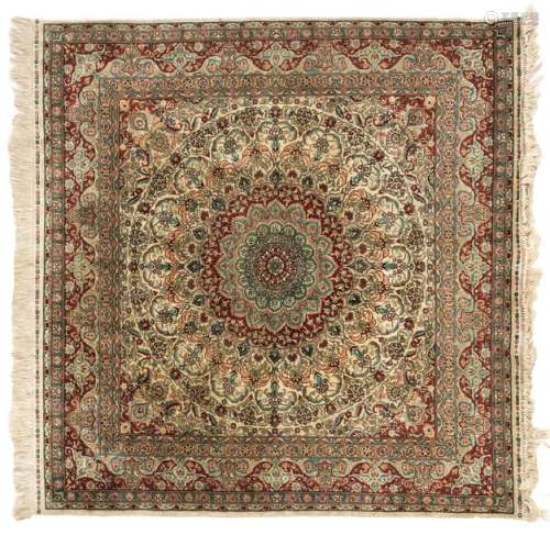 An Oriental square silk carpet with floral motifs …