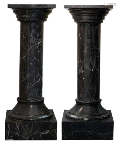 Two imposing 'Bleu Belge' marble columns, H 156 cm