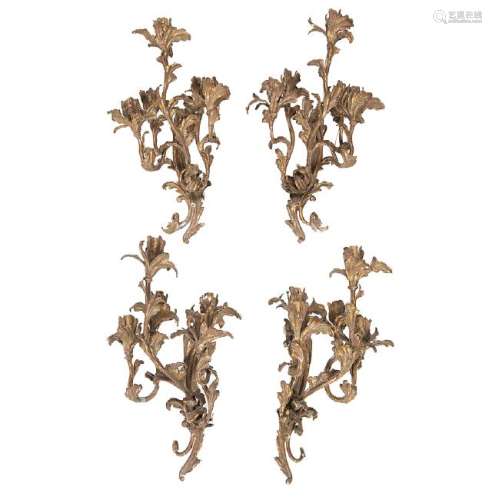 Set of four Louis XV style wall lamps in gilt metal,