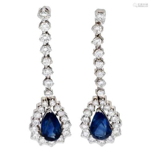 Sapphires and diamonds long earrings.