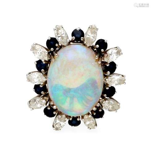 Ring with opal and diamonds and sapphires border.