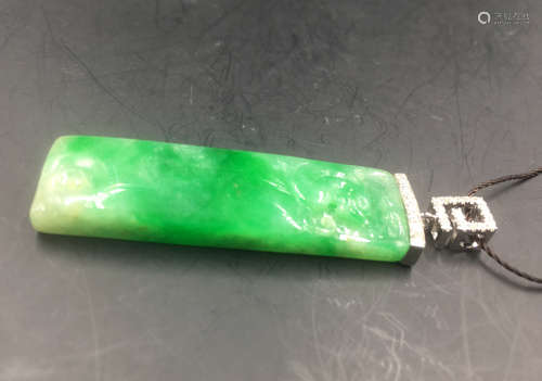 A FLAT JADEITE PLATINUM PENDANT