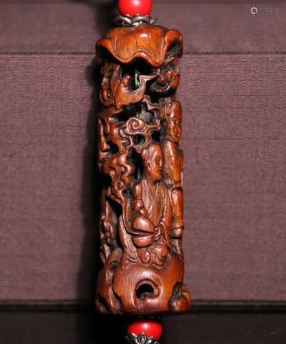 A BAMBOO CARVED HOLLOW PATTERN PENDANT