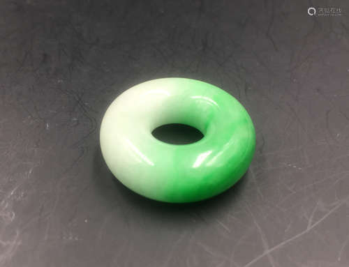 A RING-SHAPED JADEITE PENDANT