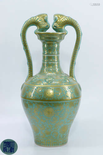 A GREEN GLAZE GILDED DRAGON SHAPED VASE