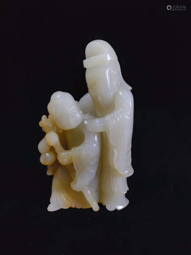 A HETIAN JADE CARVED FIGURE PENDANT