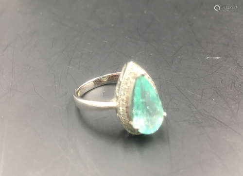 A PARAIBA TOURMALINE WITH DIAMOND K-GOLD RING