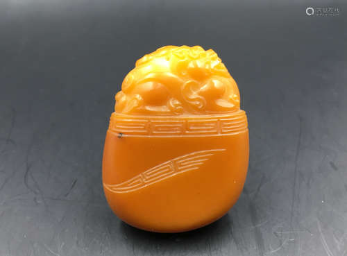 A HETIAN YELLOW JADE CARVED BEAST DESIGN PENDANT