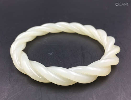 A HETIAN JADE CARVED BANGLE