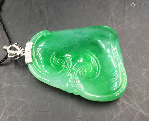 A RUYI SHAPED JADEITE PENDANT