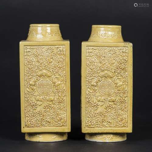 A PAIR OF YELLOW GLAZED SQUARE-SECTIONED VASES