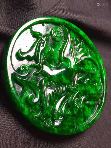 A PAIR OF DRAGON AND PHOENIX PATTERN GREEN JADEITE