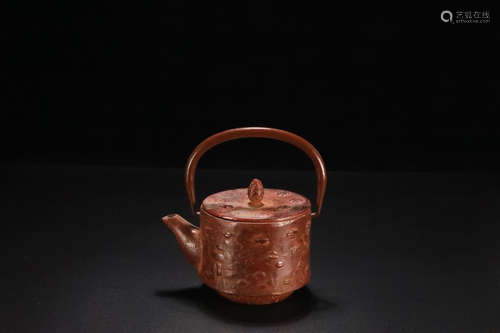 A CHRYSANTHEMUM DESIGN IRON TEAPOT