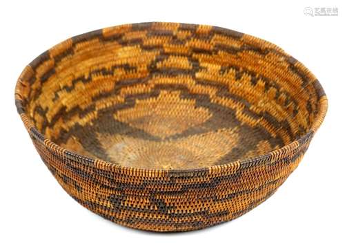 Northwest California Native American Pomo coiled basket, having a continuous geometric pattern